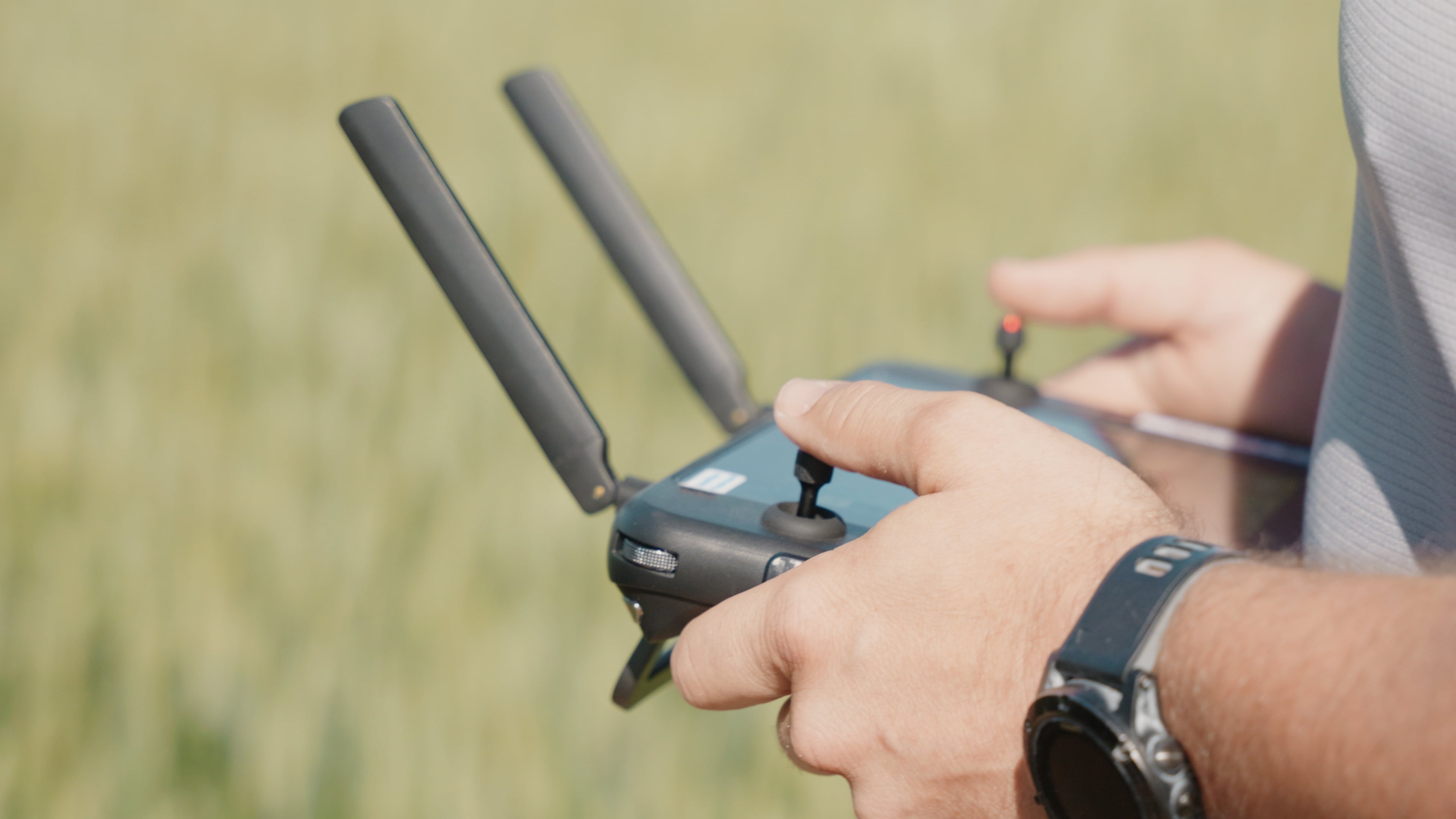 Operator using Autel drone controller in the field